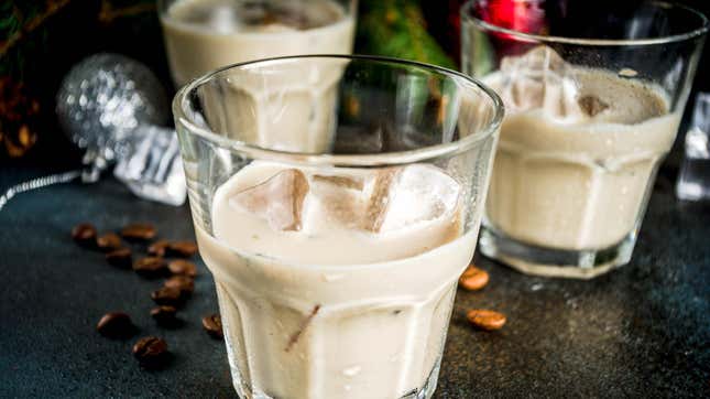 Creamy liqueurs against holiday background