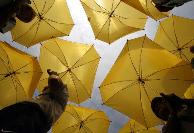 Protesters open umbrellas to form the numbers 2-0-1-2 as year '2012' in a Hong Kong park Sunday, Oct. 7, 2007, as they demand the right to pick the city's leader and entire legislature in 2012. The government has issued a consultation paper containing various proposals on how and when the city's leader and legislature should be elected. However, pro-democracy lawmakers who want direct elections as soon as possible have criticized the document, saying it's confusing to the public because it lists many options.