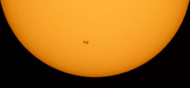 NELLYSFORD, VIRGINIA - JUNE 25: In this handout image provided by NASA, The International Space Station, with a crew of seven onboard, is seen in silhouette as it transits the Sun at roughly five miles per second. 
