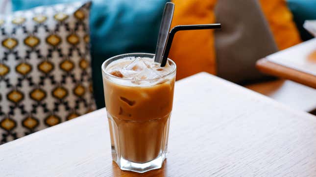 Glass of Vietnamese iced coffee with a straw