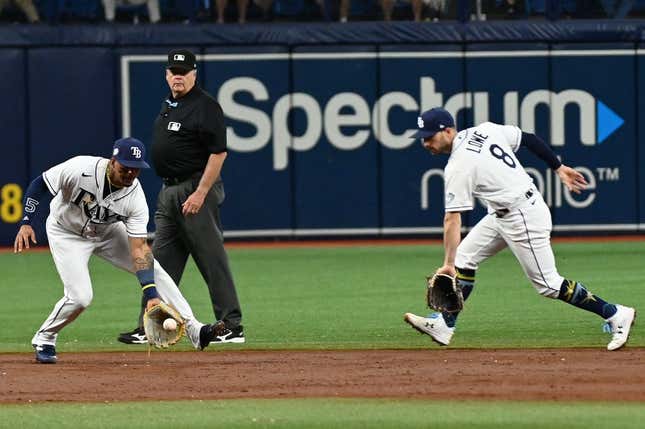 Apr 26, 2023; St. Petersburg, Florida, USA; Tampa Bay Rays shortstop Wander Franco (left) fields a ground ball in front of second baseman Brandon Lowe (8) in the third inning against the Houston Astros at Tropicana Field.