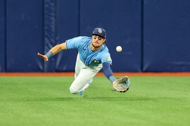 Apr 13, 2023; St. Petersburg, Florida, USA;  Tampa Bay Rays center fielder Josh Lowe (15) dives for a ball against the Boston Red Sox in the fifth inning at Tropicana Field.