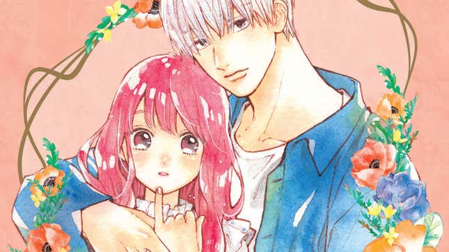 Yuki and her hunky boyfriend are surrounded by flowers.