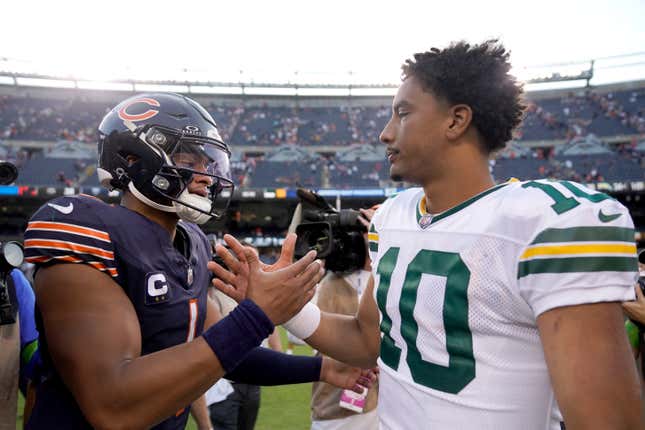 Jordan Love and Justin Fields meet at midfield yesterday after the Packers’ 38-20 victory over the Bears.
