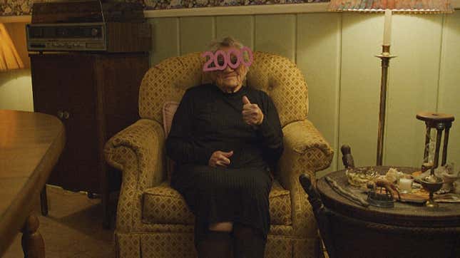 A person wearing year 2000 celebratory glasses.