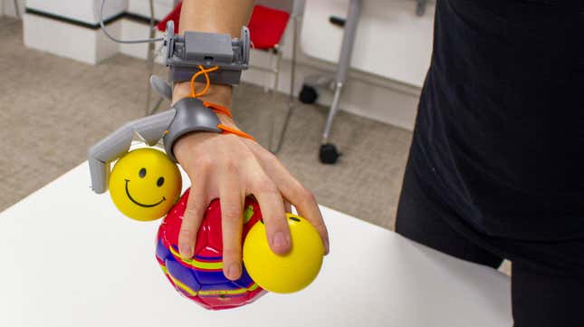 The Third Thumb being used to hold multiple balls.