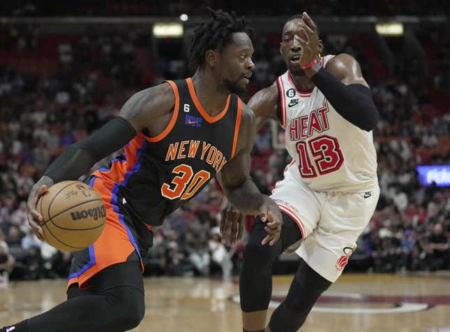Mar 3, 2023; Miami, Florida, USA;  New York Knicks forward Julius Randle (30) drives past Miami Heat center Bam Adebayo (13) during the first half at Miami-Dade Arena.