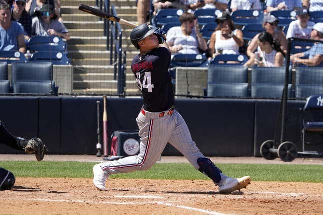 Mar 24, 2023; Tampa, Florida, USA; Minnesota Twins first baseman Jose Miranda (64) flies out against the New York Yankees during the sixth inning at George M. Steinbrenner Field.