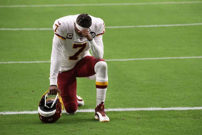 Quarterback Dwayne Haskins #7 of the Washington Football Team kneels on the field before the NFL game against the Arizona Cardinals at State Farm Stadium on September 20, 2020, in Glendale, Arizona.