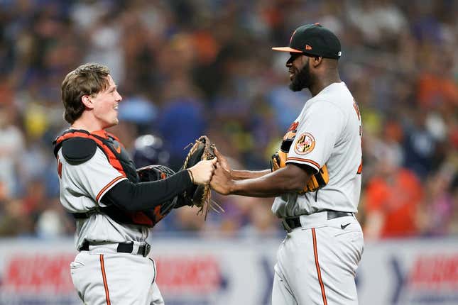 Jul 20, 2023; St. Petersburg, Florida, USA;  Baltimore Orioles catcher Adley Rutschman (35) and relief pitcher Felix Bautista (74) celebrate after beating the Tampa Bay Rays in eleventh innings at Tropicana Field.