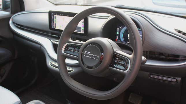 A photo of the steering wheel in a Fiat 500 EV. 