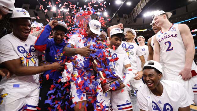 The Kansas Jayhawks celebrate after defeating the Miami (Fl) Hurricanes during the Elite Eight round of the 2022 NCAA Mens Basketball Tournament held at the United Center in Chicago.