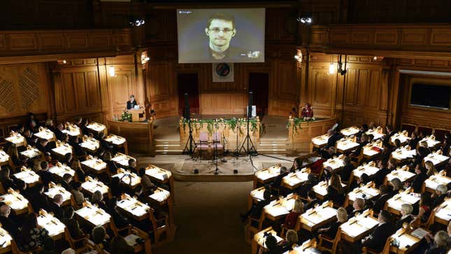 DATE IMPORTED:December 01, 2014Swedish Member of Parliament Barbro Westerholm (L) speaks to former U.S. NSA contractor Edward Snowden, shown on a livestream from Moscow, during the Right Livelihood Award ceremony at the second chamber hall at the Swedish Parliament in Stockholm December 1, 2014.