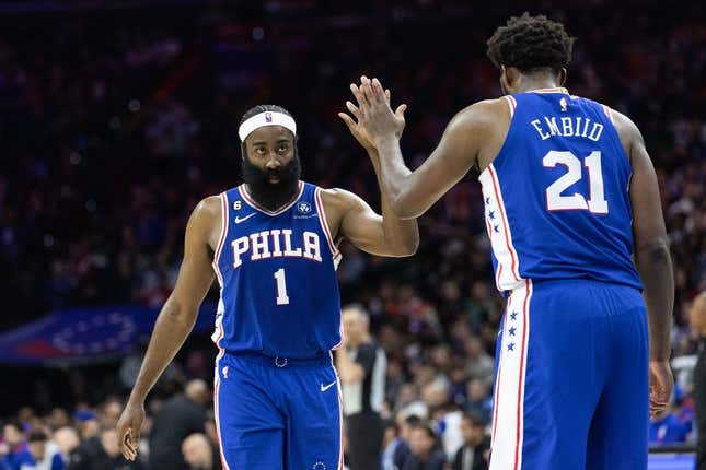 Feb 23, 2023; Philadelphia, Pennsylvania, USA; Philadelphia 76ers guard James Harden (1) and center Joel Embiid (21) high five after a score against the Memphis Grizzlies during the fourth quarter at Wells Fargo Center.