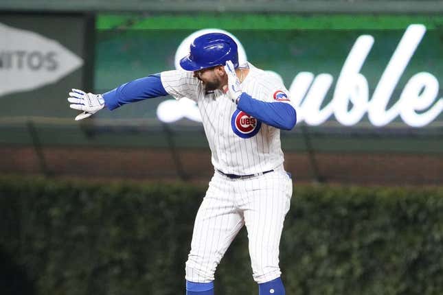 Aug 2, 2023; Chicago, Illinois, USA; Chicago Cubs center fielder Mike Tauchman (40) gestures after hitting a one run double against the Cincinnati Reds during the sixth inning at Wrigley Field.