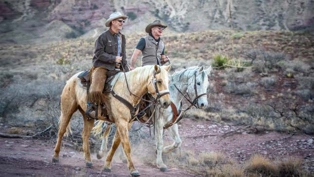 Jeff and Mark Bezos, on horseback.