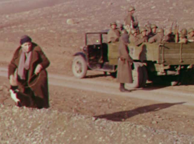 Mrs Skrine walks her cats, with the Red Army behind. As you do. Still from Quetta-Damghan.