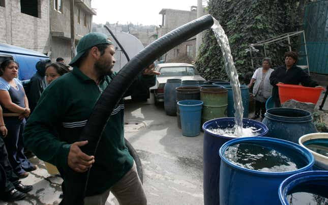 A city pipa worker delivers a weekly ration of water for residents. In some parts of the city, the government provides water rations. In other parts, residents pay for it. In both cases, waiting for water to arrive can be a full-time job.
