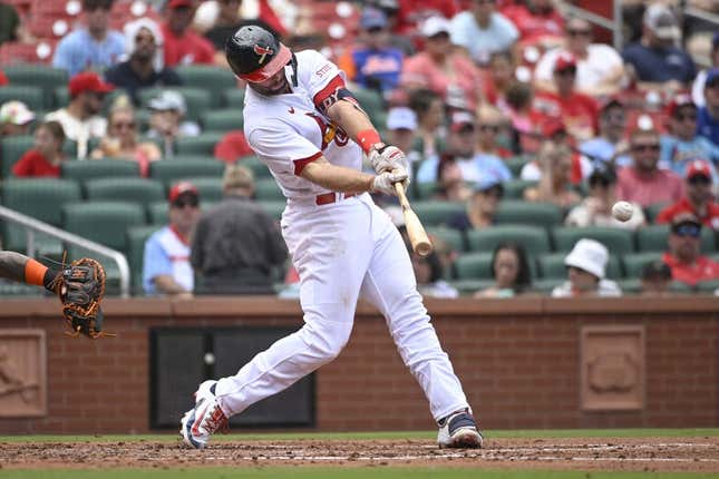 Aug 20, 2023; St. Louis, Missouri, USA; St. Louis Cardinals first baseman Paul Goldschmidt (46) hits an RBI single against the New York Mets in the third inning at Busch Stadium.