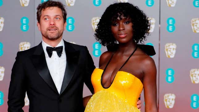  Joshua Jackson and Jodie Turner Smith pose on the red carpet upon arrival at the BAFTA British Academy Film Awards on February 2, 2020.