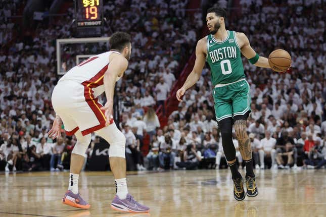 May 27, 2023; Miami, Florida, USA; Boston Celtics forward Jayson Tatum (0) controls the ball against Miami Heat guard Max Strus (31) in the third quarer during game six of the Eastern Conference Finals for the 2023 NBA playoffs at Kaseya Center.