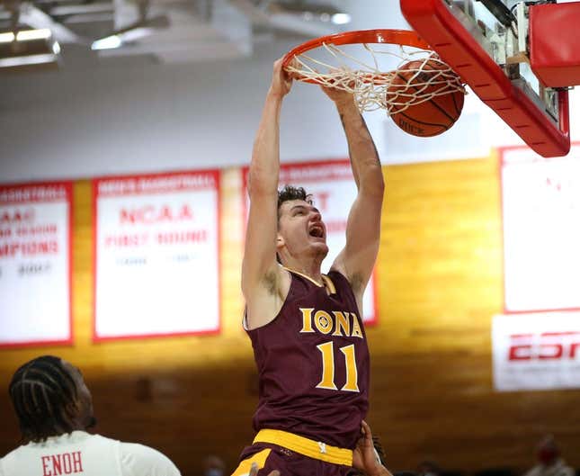 Iona&#39;s Quinn Slazinski slam dunks on Marist&#39;s Victor Enoh during Wednesday&#39;s game in Poughkeepsie on December 1, 2021.

Marist Vs Iona Basketball