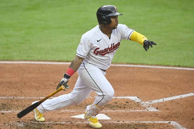 May 6, 2023; Cleveland, Ohio, USA; Cleveland Guardians third baseman Jose Ramirez (11) hits a single against the Minnesota Twins in the fourth inning at Progressive Field.