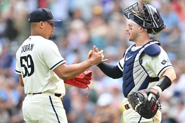 Aug 20, 2023; Minneapolis, Minnesota, USA; Minnesota Twins relief pitcher Jhoan Duran (59) and catcher Ryan Jeffers (27) react after the game against the Pittsburgh Pirates at Target Field.