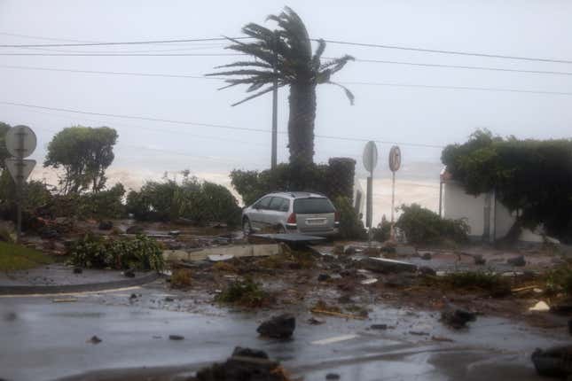 Debris blocks a road in the seafront village of Feteira, outside Horta.