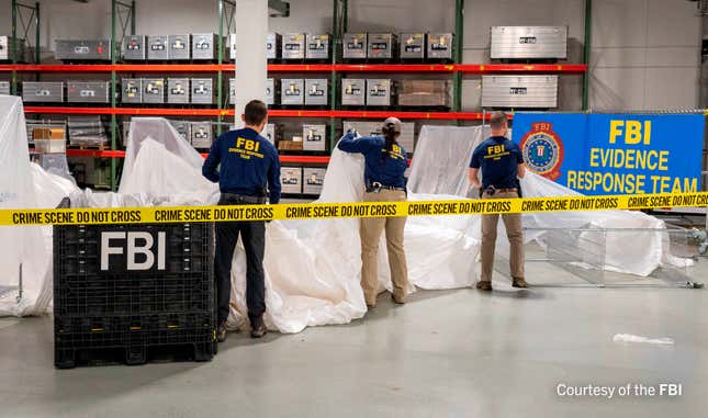 An undated U.S. Federal Bureau of Investigation handout photo taken at an undisclosed location shows FBI Special Agents assigned to the bureau’s Evidence Response Team processing material recovered from the high-altitude Chinese balloon that was shot down by a U.S. military jet off the coast of South Carolina, in this image released by the FBI on February 9, 2023. 