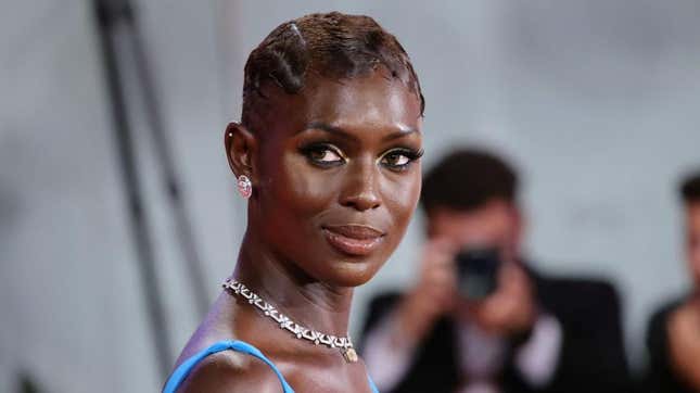 Turner-Smith in a blue dress on the red carpet