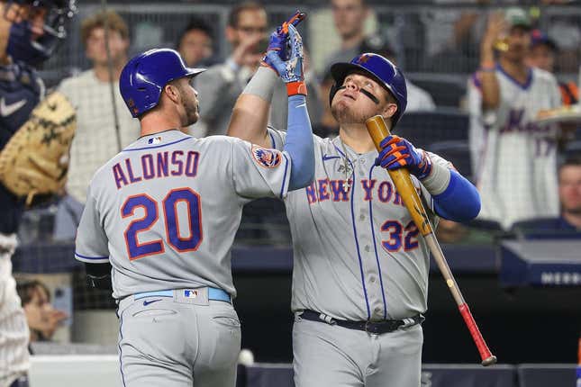 Jul 25, 2023; Bronx, New York, USA; New York Mets first baseman Pete Alonso (20) celebrates his solo home run with designated hitter Daniel Vogelbach (32) during the sixth inning against the New York Yankees at Yankee Stadium.