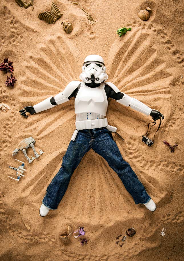 Toy Stormtrooper Eric makes a sand angel.