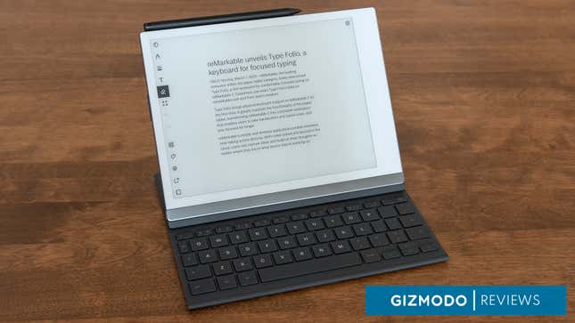The reMarkable 2 e-note device with the Type Folio keyboard case attached, sitting on a wooden table.