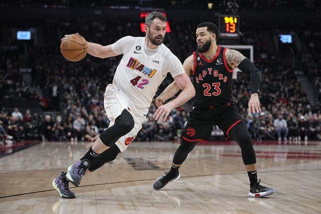 Mar 28, 2023; Toronto, Ontario, CAN; Miami Heat forward Kevin Love (42) drives to the net against Toronto Raptors guard Fred VanVleet (23) during the first half at Scotiabank Arena.