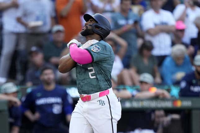 Jul 11, 2023; Seattle, Washington, USA; American League first baseman  Yandy Diaz  of the Tampa Bay Rays (2) reacts after hitting a home run during the second inning at T-Mobile Park.