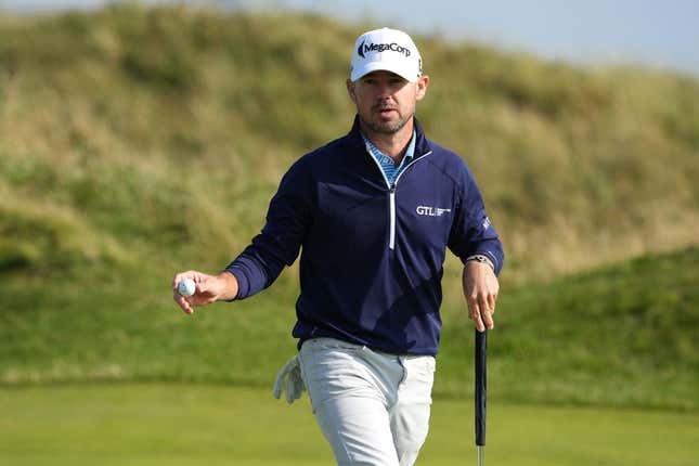 July 20, 2023; Hoylake, England, GBR; Brian Harman acknowledges the crowd after a putt during the first round of The Open Championship golf tournament at Royal Liverpool.