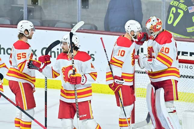 Feb 22, 2023; Tempe, Arizona, USA; The Calgary Flames celebrate after defeating the Arizona Coyotes at Mullett Arena.