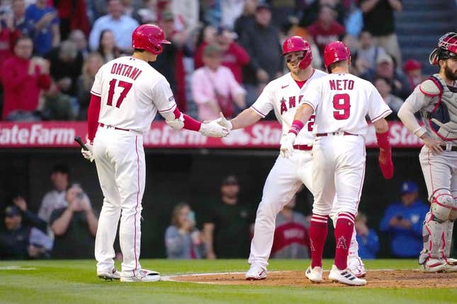May 24, 2023; Anaheim, California, USA; Los Angeles Angels center fielder Mike Trout (27) celebrates with shortstop Zach Neto (9) and designated hitter Shohei Ohtani (17) after hitting a two-run home run in the fourth inning against the Boston Red Sox at Angel Stadium.