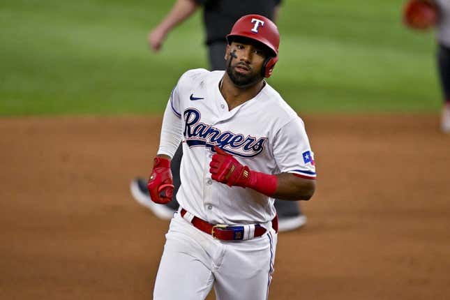 May 16, 2023; Arlington, Texas, USA; Texas Rangers shortstop Ezequiel Duran (20) rounds the bases after he hits a home run against the Atlanta Braves during the eighth inning at Globe Life Field.