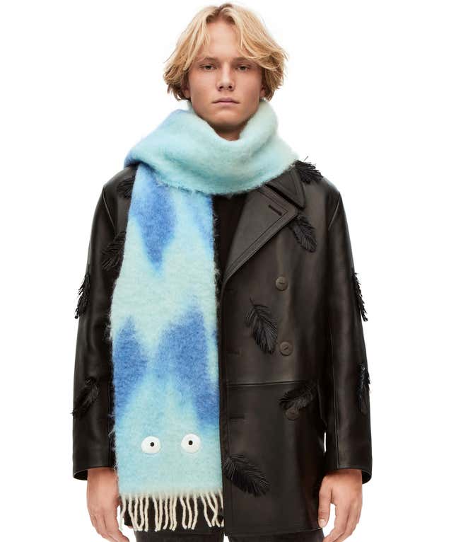 A screenshot of an oversized scarf with shades of blue and Calcifer's eyes at the bottom.