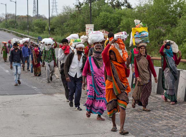 Scores of migrant workers and daily wagers walk back to their villages from Delhi.
