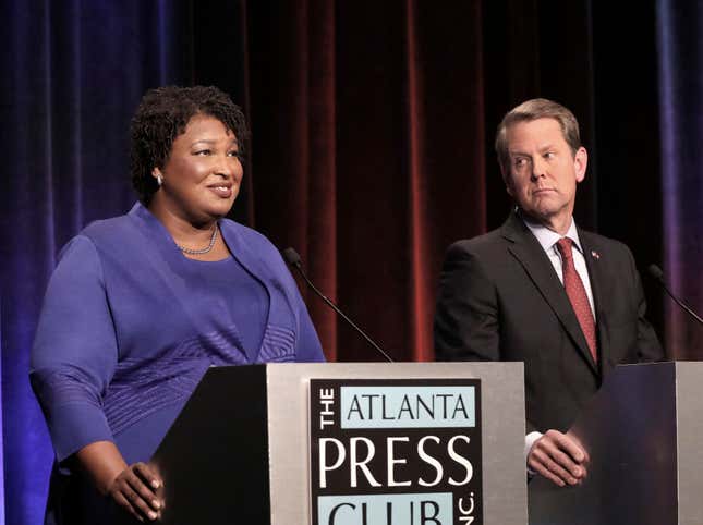 Georgia gubernatorial candidates (L-R) Democrat Stacey Abrams and Republican Brian Kemp debate in an event that also included Libertarian Ted Metz at Georgia Public Broadcasting in Midtown October 23, 2018 in Atlanta, Georgia.