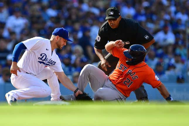 Jun 24, 2023; Los Angeles, California, USA; Houston Astros catcher Yainer Diaz (21) is out at third against the tag of Los Angeles Dodgers third baseman Michael Busch (83) during the fourth inning at Dodger Stadium.