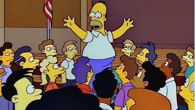A screenshot of The Simpsons shows Homer standing above a large crowd. 