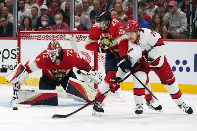May 22, 2023; Sunrise, Florida, USA; Florida Panthers goaltender Sergei Bobrovsky (72) makes a save behind defenseman Josh Mahura (28) and Carolina Hurricanes right wing Jesper Fast (71) during the first period in game three of the Eastern Conference Finals of the 2023 Stanley Cup Playoffs at FLA Live Arena.
