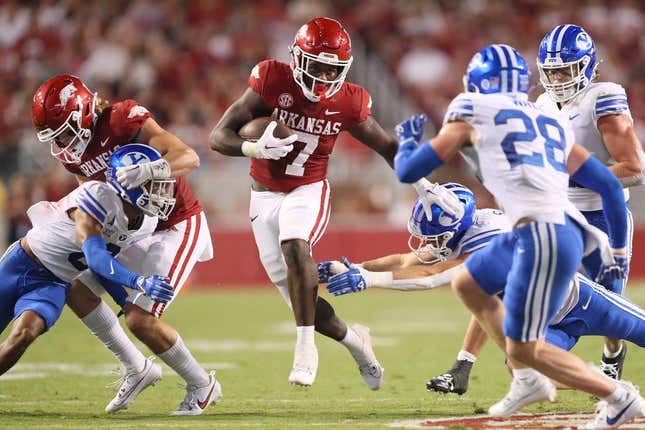 Sep 16, 2023; Fayetteville, Arkansas, USA; Arkansas Razorbacks running back Rashod Dubinion (7) rushes in the second quarter against the BYU Cougars at Donald W. Reynolds Razorback Stadium.
