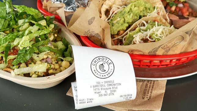 Chipotle burrito bowl and tacos with guacamole beside receipt