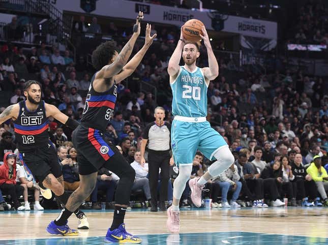 Feb 27, 2023; Charlotte, North Carolina, USA; Charlotte Hornets forward Gordon Hayward (20) shoots as he is defended by Detroit Pistons forward Marvin Bagley III (35) during the first half at the Spectrum Center.