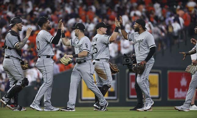 Mar 30, 2023; Houston, Texas, USA; Chicago White Sox first baseman Andrew Vaughn (25) celebrates with teammates after the White Sox defeated the Houston Astros at Minute Maid Park.